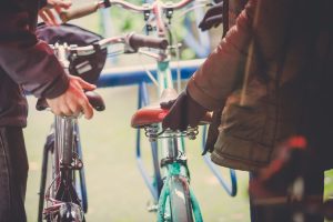 Two People with Bikes on Granville Island